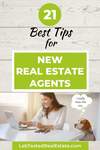 New agent reading real estate tips on laptop with her dog